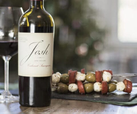 Olive, Mozzarella, and Chorizo Skewers with a bottle of Josh wines